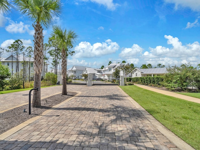 218 White Cottage Rd, Santa Rosa Beach, FL 32459 - exterior space featuring fence, a residential view, and a lawn