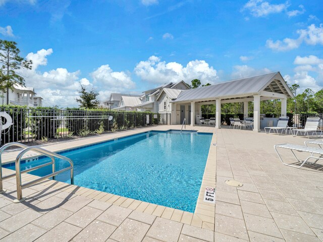 view of swimming pool with a patio