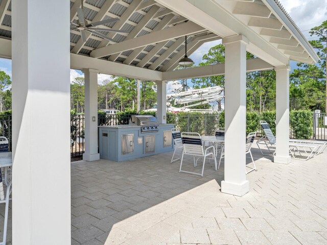 view of patio featuring a gazebo, an outdoor kitchen, ceiling fan, and grilling area