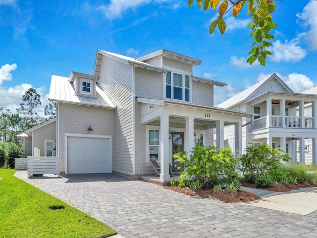 218 White Cottage Rd, Santa Rosa Beach, FL 32459 - view of front of property featuring an attached garage, decorative driveway, and a front lawn