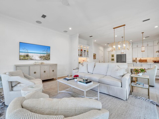 living room featuring crown molding