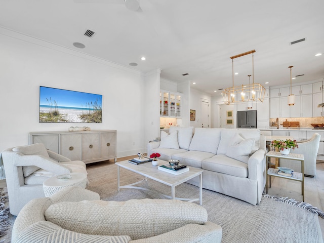 218 White Cottage Rd, Santa Rosa Beach, FL 32459 - living room featuring recessed lighting, light wood finished floors, visible vents, and ornamental molding