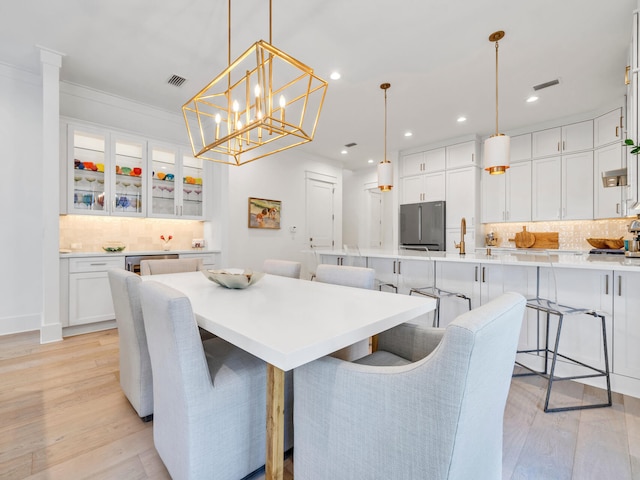 218 White Cottage Rd, Santa Rosa Beach, FL 32459 - dining room featuring light wood-style floors, visible vents, and recessed lighting