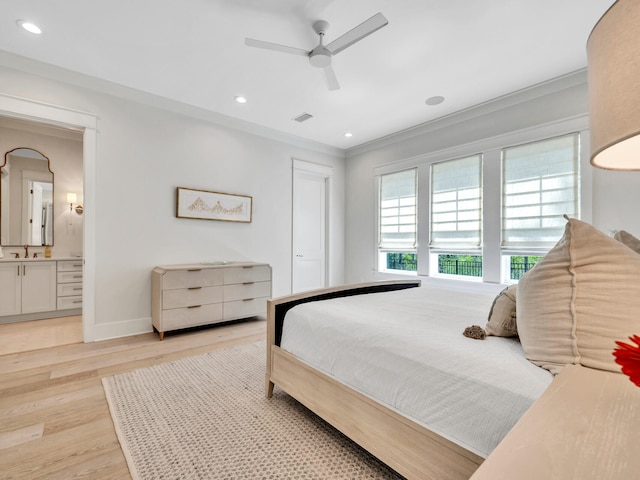 218 White Cottage Rd, Santa Rosa Beach, FL 32459 - bedroom with baseboards, recessed lighting, light wood-type flooring, and crown molding