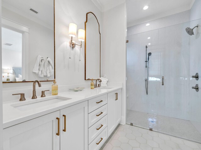 bathroom with tile patterned floors, vanity, an enclosed shower, and ornamental molding