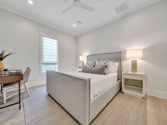 bedroom with ceiling fan, light wood-type flooring, and ornamental molding