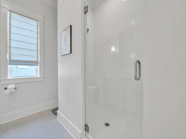 bathroom with a shower with shower door