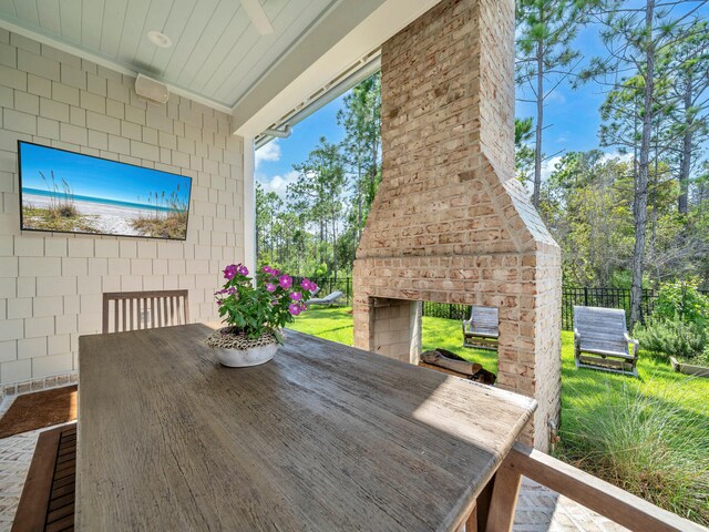 exterior space with an outdoor brick fireplace