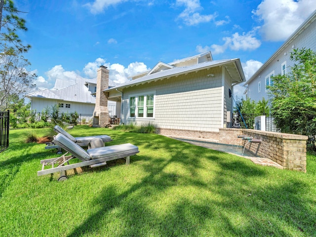 218 White Cottage Rd, Santa Rosa Beach, FL 32459 - rear view of property featuring fence and a lawn