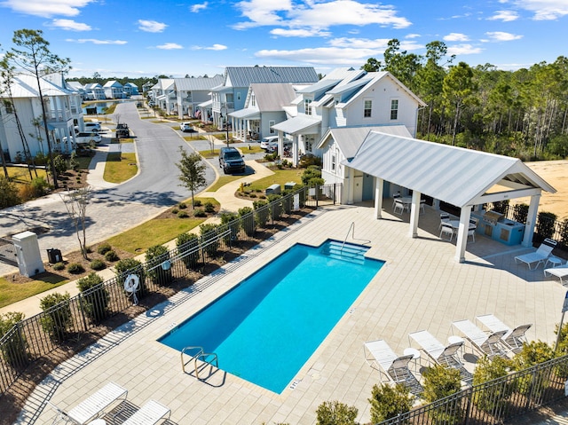 218 White Cottage Rd, Santa Rosa Beach, FL 32459 - community pool featuring a patio area, fence, and a residential view