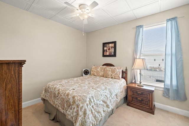 bedroom featuring ceiling fan and light colored carpet