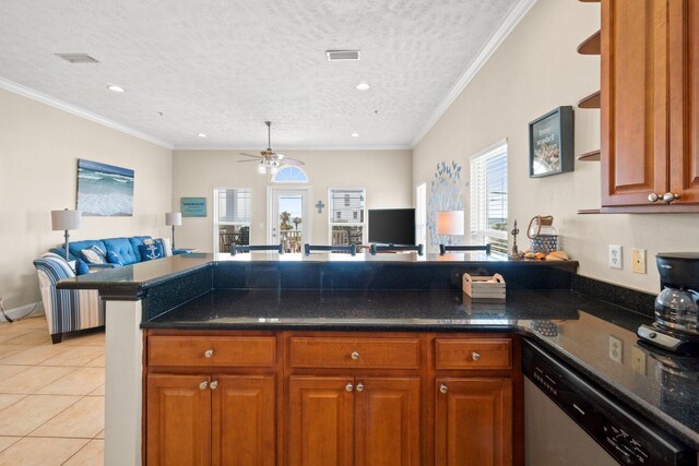 kitchen featuring a textured ceiling, light tile patterned flooring, ornamental molding, ceiling fan, and stainless steel dishwasher