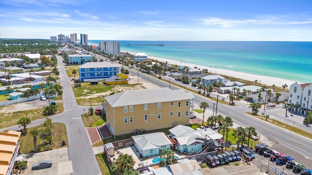 drone / aerial view with a water view and a view of the beach