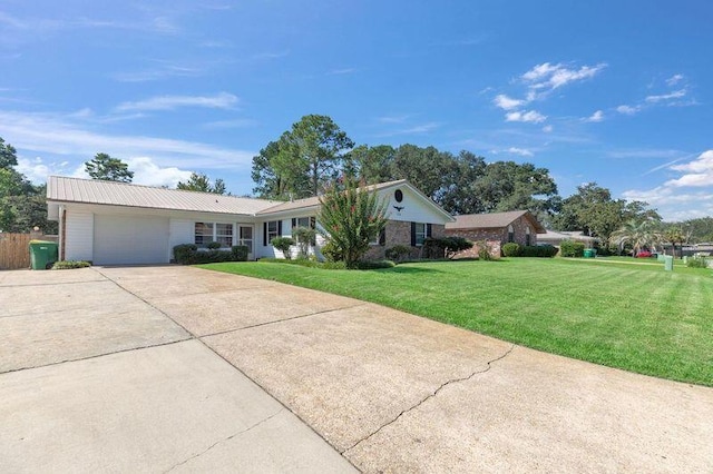 ranch-style home with a garage and a front yard