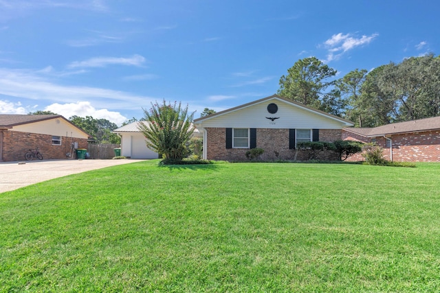 ranch-style home featuring a front yard and a garage