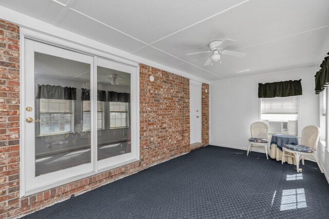 interior space featuring ceiling fan and cooling unit