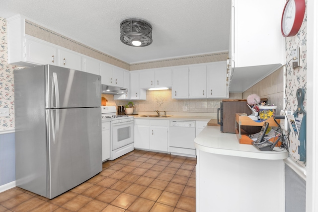 kitchen featuring white cabinetry, white appliances, light tile patterned floors, a textured ceiling, and sink