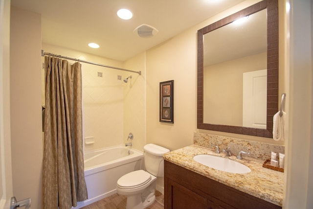 full bathroom with vanity, hardwood / wood-style floors, toilet, and shower / bathtub combination with curtain