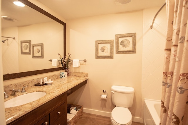 full bathroom featuring vanity, shower / bath combo with shower curtain, toilet, and hardwood / wood-style flooring