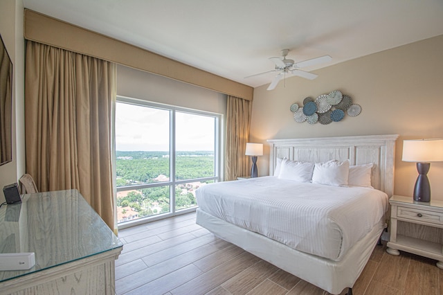 bedroom featuring ceiling fan and light hardwood / wood-style flooring