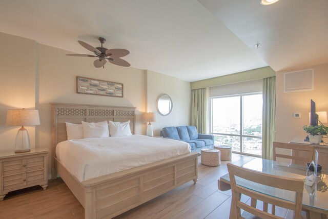 bedroom featuring ceiling fan and light hardwood / wood-style flooring