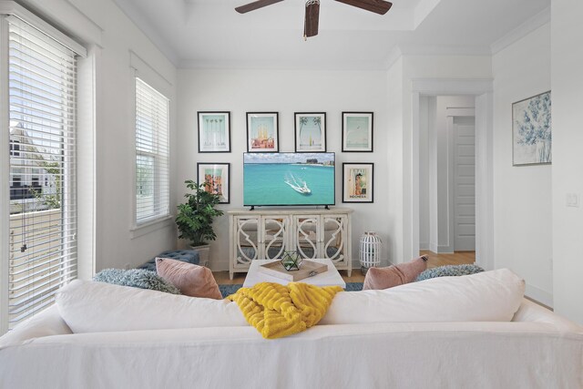 bedroom with ceiling fan, hardwood / wood-style flooring, and crown molding