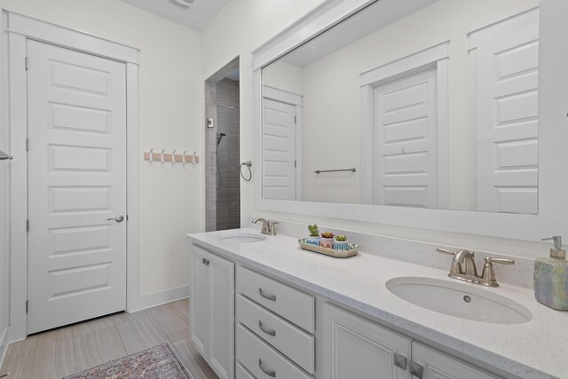 bathroom with a shower and vanity