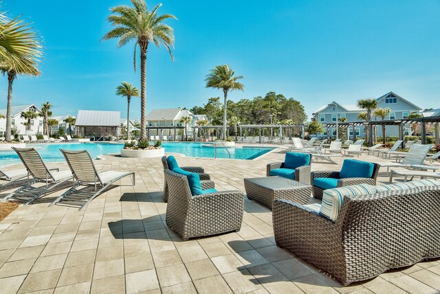 view of swimming pool with a patio