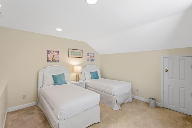 bedroom with light carpet and lofted ceiling