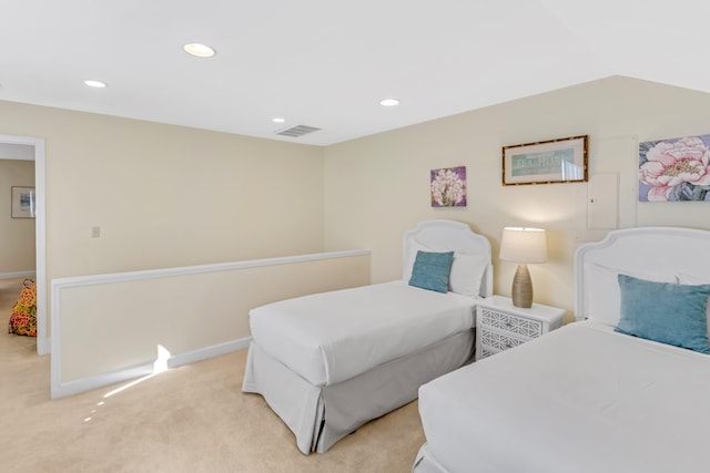 bedroom featuring light colored carpet and vaulted ceiling