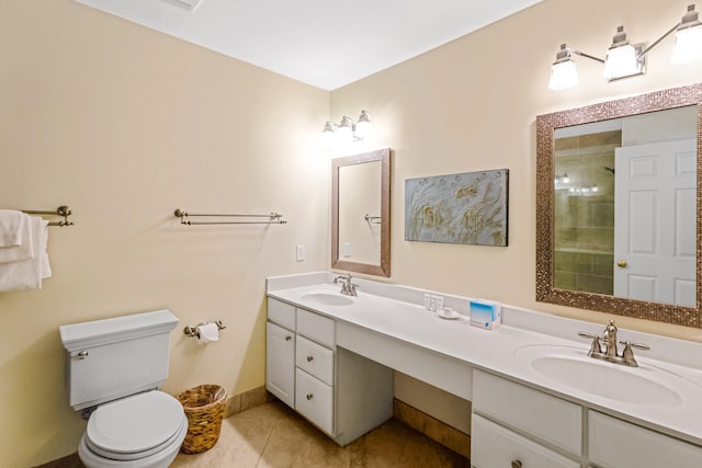 bathroom with tile patterned flooring, vanity, toilet, and a shower with door