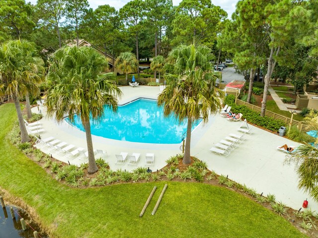 view of pool featuring a lawn and a patio area