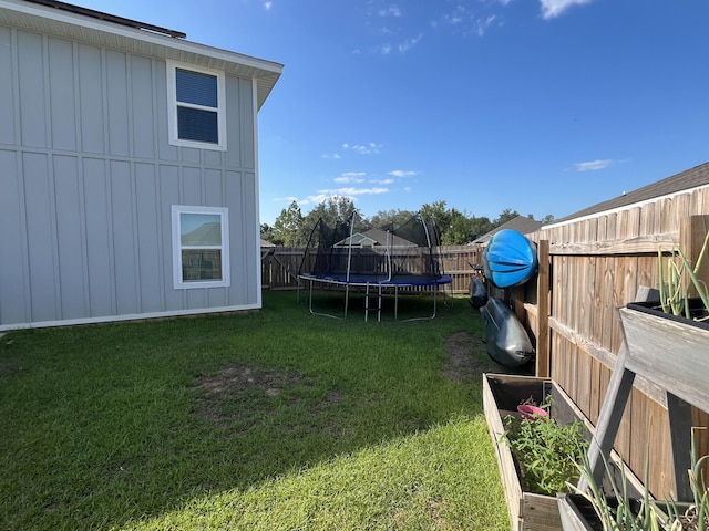 view of yard featuring a trampoline