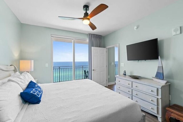 bedroom with dark wood-type flooring, ceiling fan, and access to outside