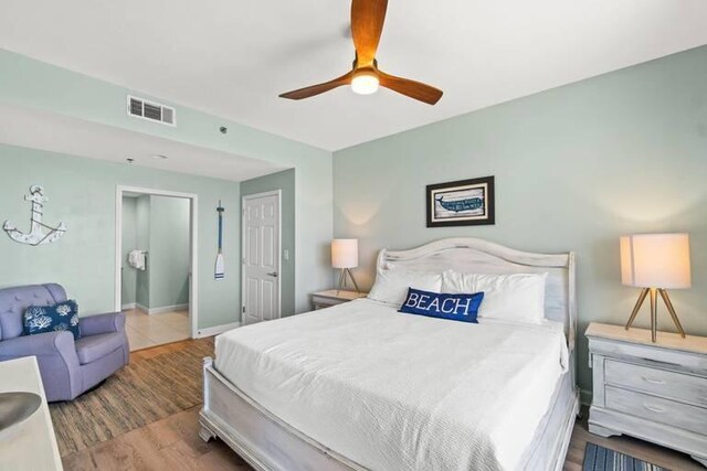 bedroom with ceiling fan and wood-type flooring