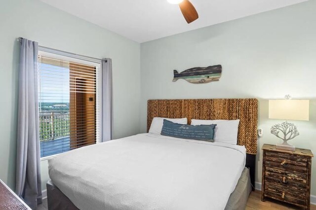 bedroom with ceiling fan and light hardwood / wood-style flooring