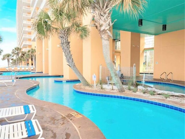 view of pool featuring a patio