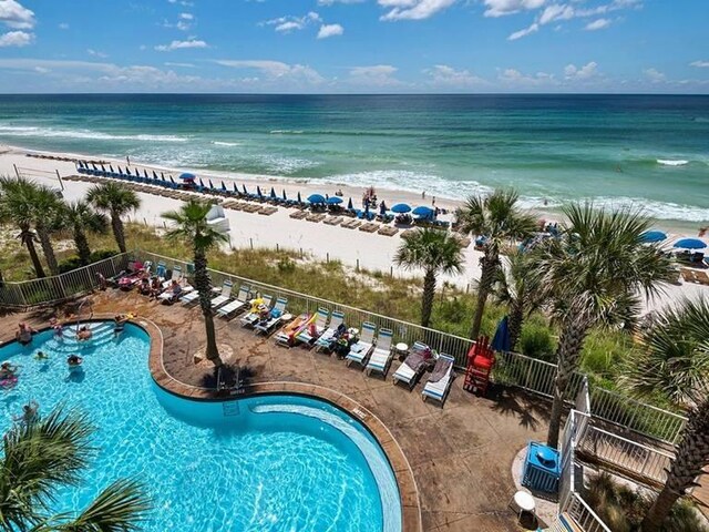 birds eye view of property featuring a view of the beach and a water view