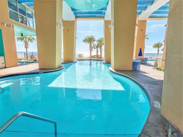 view of swimming pool featuring a patio