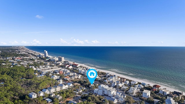 bird's eye view featuring a water view and a view of the beach