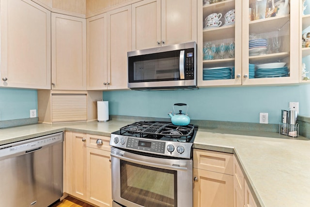 kitchen with appliances with stainless steel finishes and light wood-type flooring