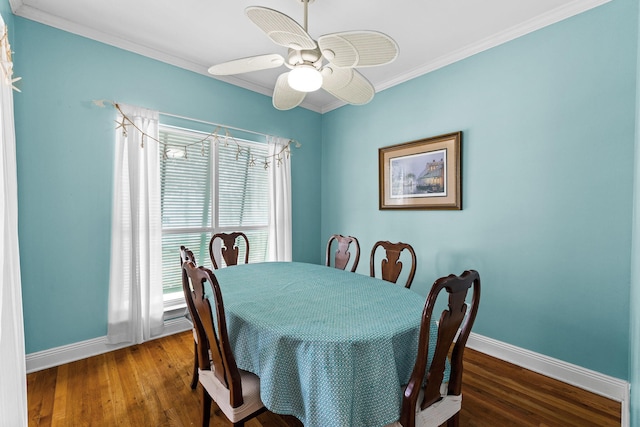 dining room featuring ornamental molding, ceiling fan, and dark hardwood / wood-style flooring