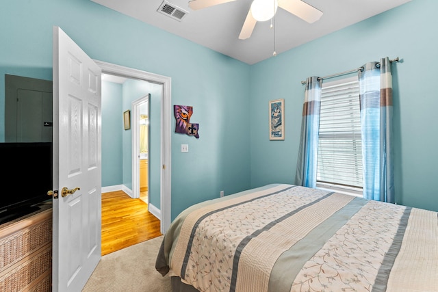 bedroom featuring light hardwood / wood-style flooring and ceiling fan