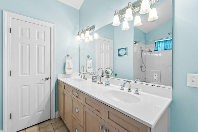 bathroom with tile patterned floors, a shower, and vanity