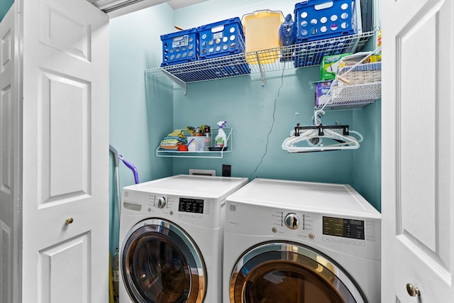 laundry area with separate washer and dryer