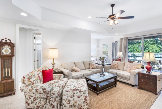 living room featuring light tile patterned floors and ceiling fan