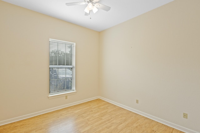 unfurnished room featuring light wood-type flooring and ceiling fan