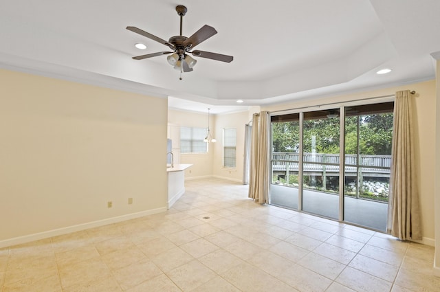 2252 Crystal Cove Ln Unit 2252, Miramar Beach, FL 32550 - spare room with recessed lighting, ceiling fan, a raised ceiling, light tile patterned floors, and baseboards