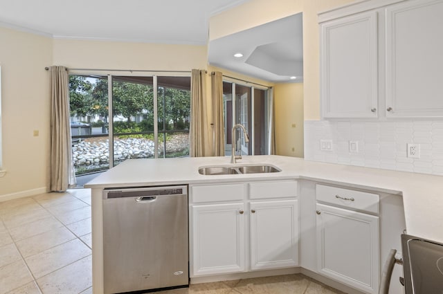 2252 Crystal Cove Ln Unit 2252, Miramar Beach, FL 32550 - kitchen featuring dishwasher, a sink, a peninsula, ornamental molding, and backsplash