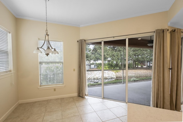 2252 Crystal Cove Ln Unit 2252, Miramar Beach, FL 32550 - unfurnished dining area featuring plenty of natural light, light tile patterned floors, baseboards, and crown molding